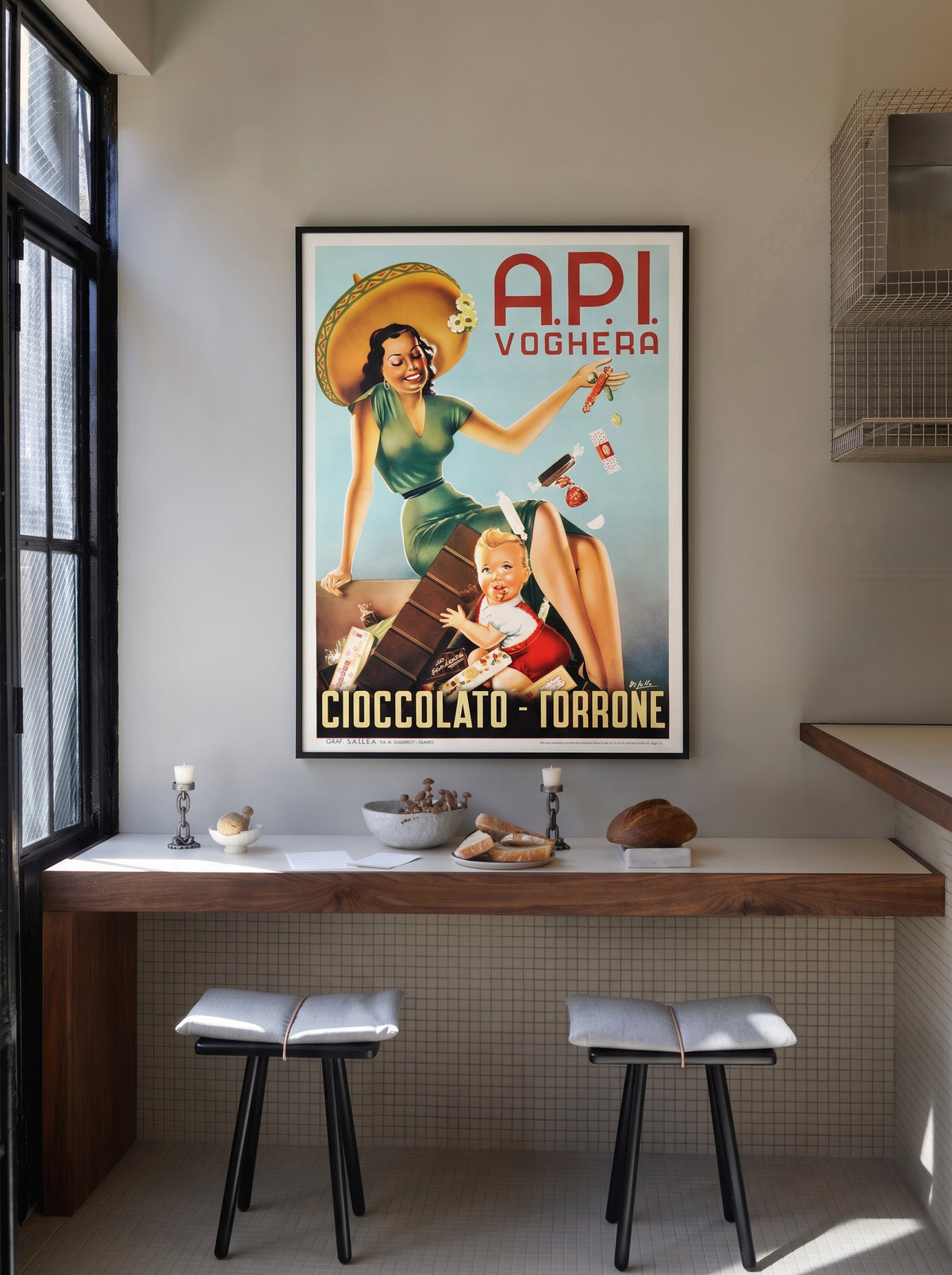 A.P.I. Voghera chocolate poster: pin-up woman showering a child with chocolates